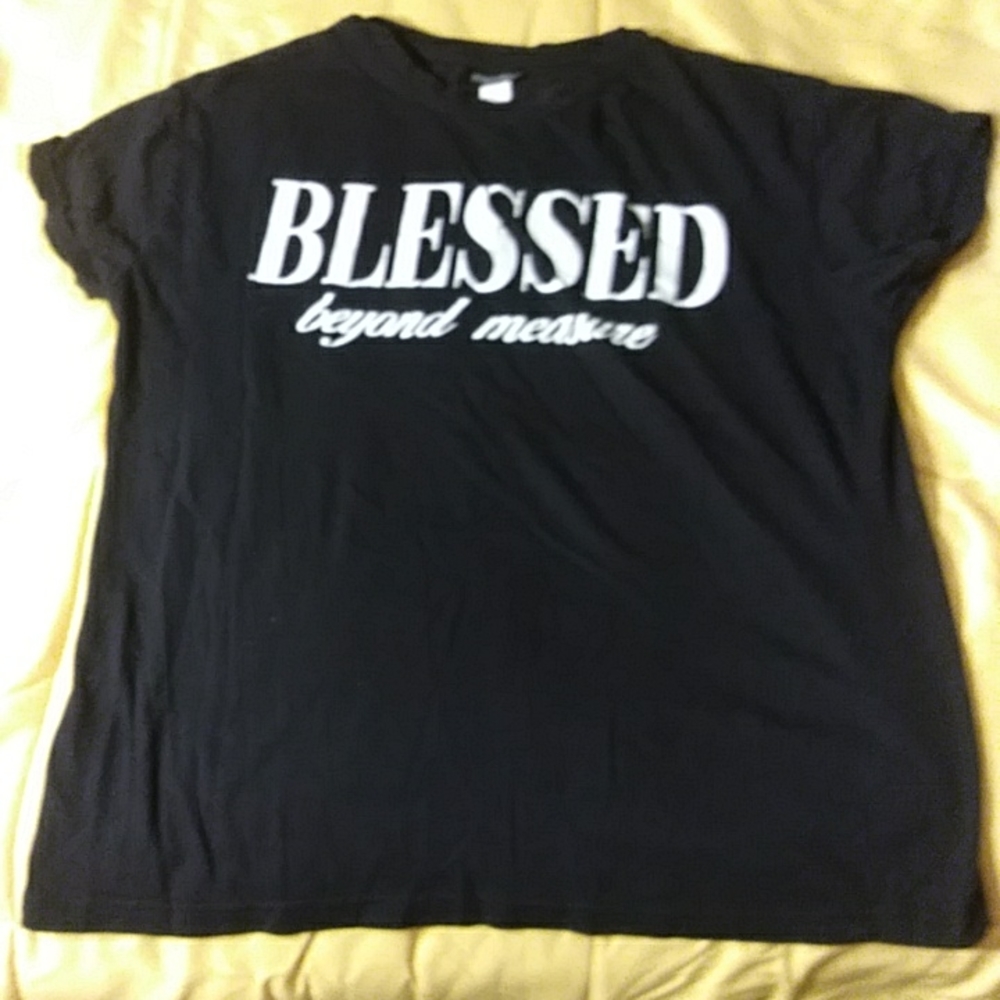 A black shirt that says blessed beyong measure